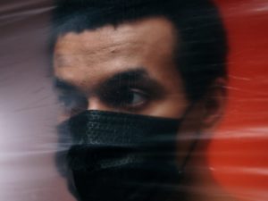 man-wearing-a-black-face-mask
