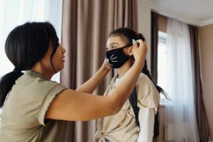 mother-putting-a-face-mask